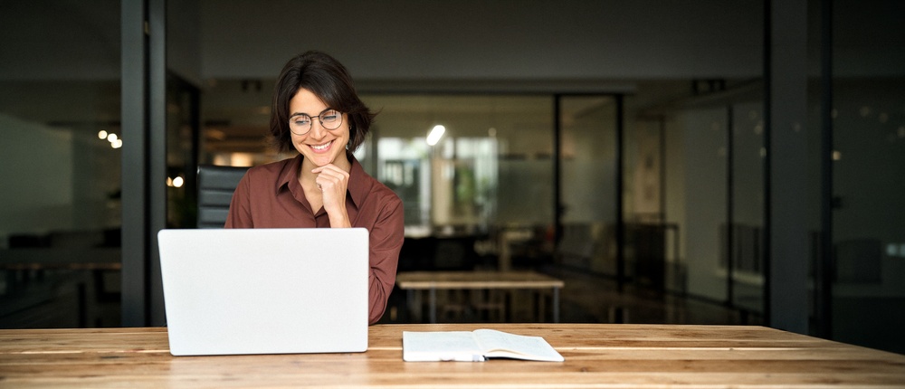 Young,Happy,Professional,Business,Woman,Executive,Working,On,Computer,Technology